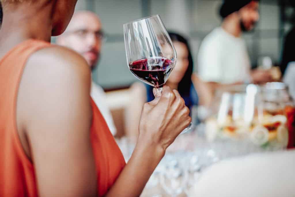 group of people drinking wine at a 5-star restaurant